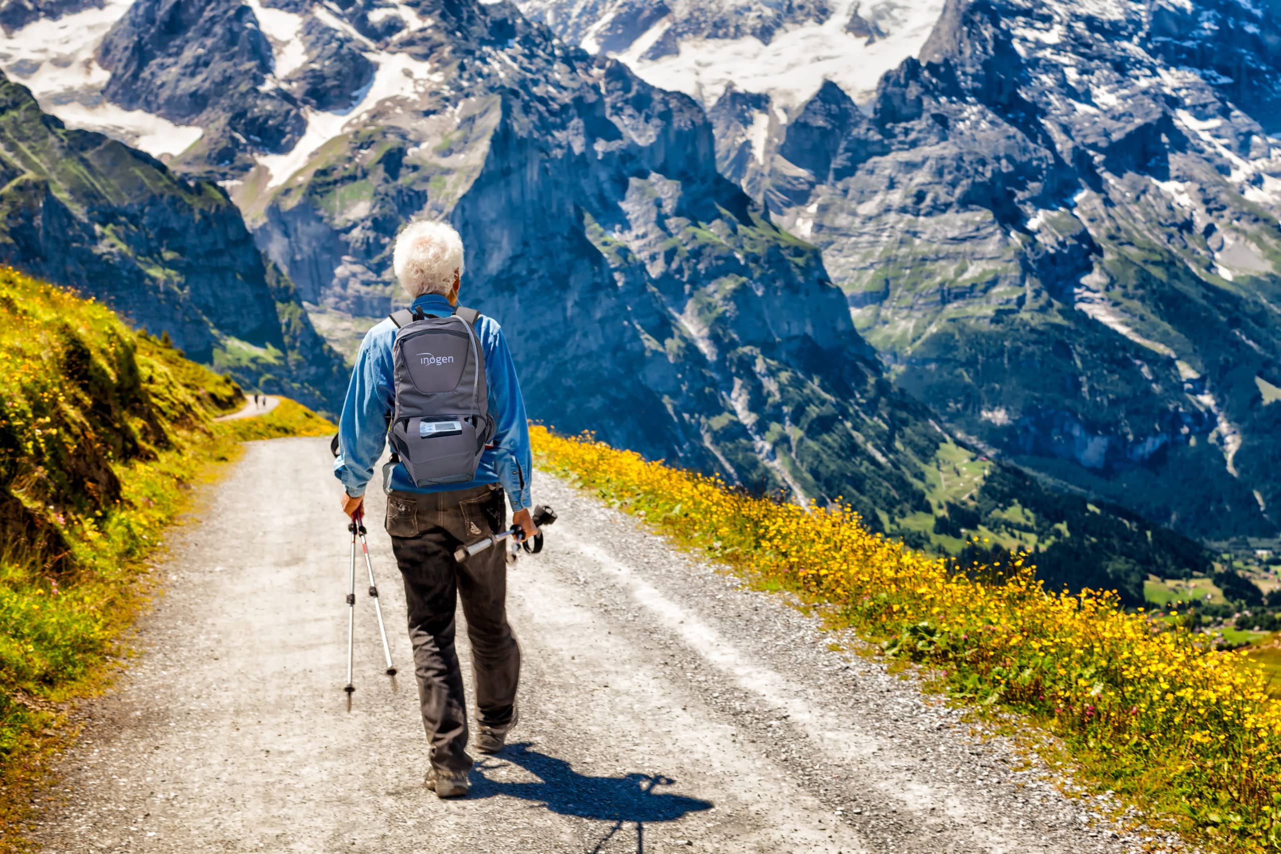 Active senior hiker on a trail in Switzerland in the Swiss Alps
